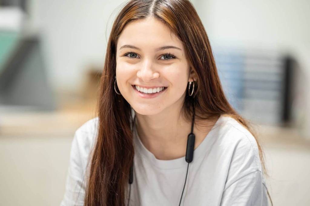 Smiling girl with headphones in