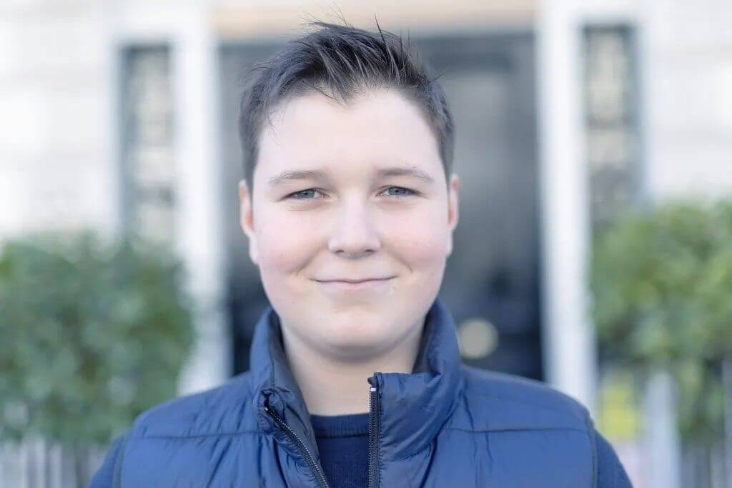 Boy smiling wearing bodywarmer