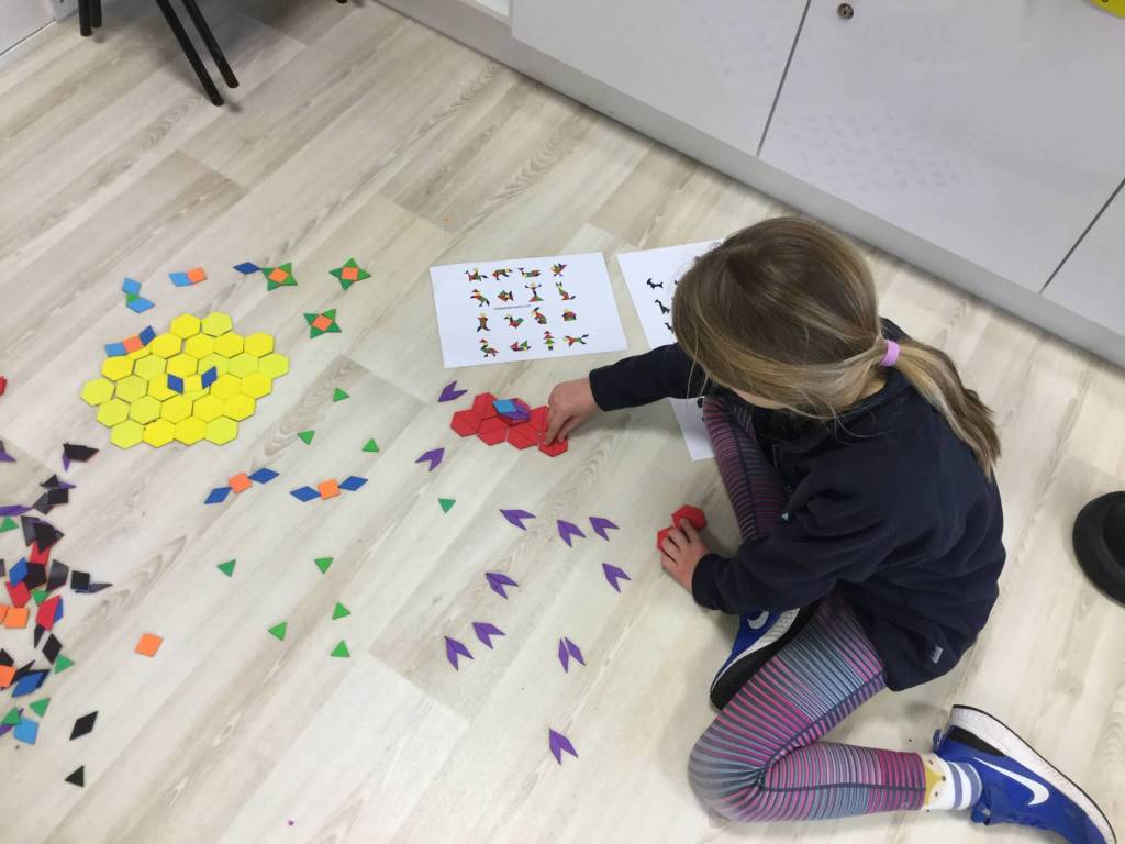 Primary students working on a mathematical equation